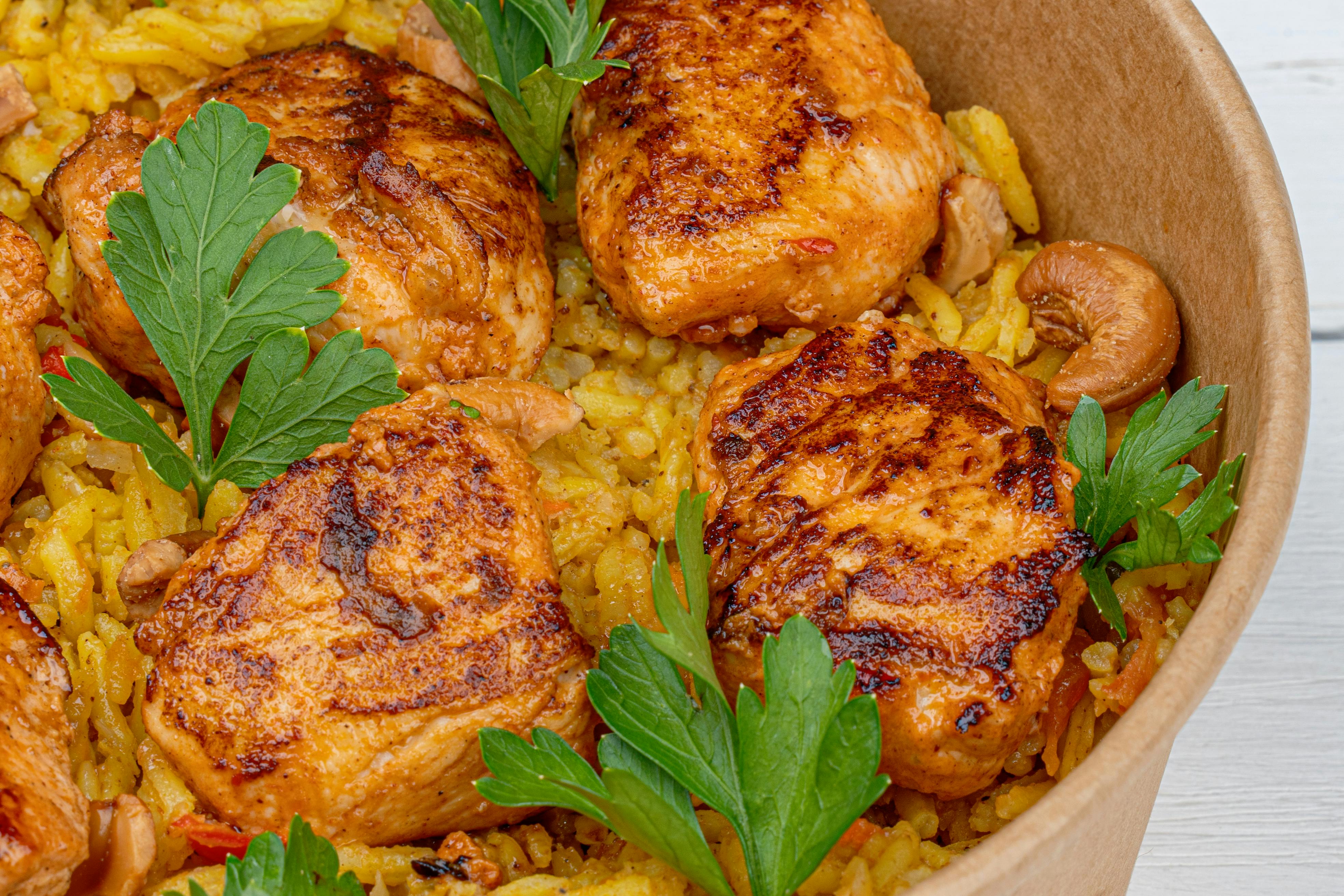 A vibrant plate of yellow rice with vegetables